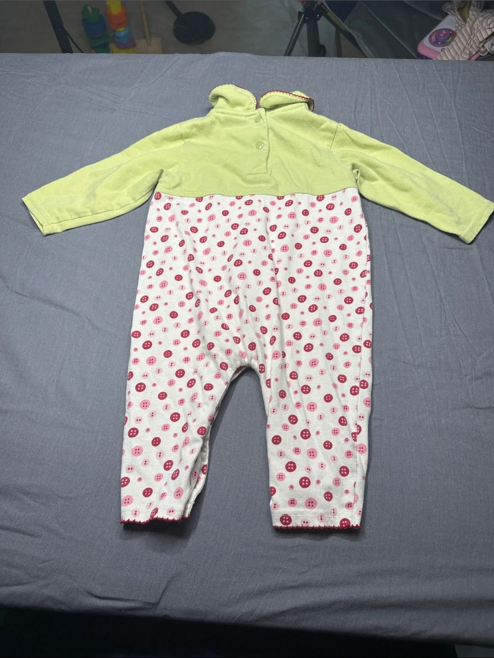 Vintage small steps Green Baby Onesie with Red Trim and Button Motif